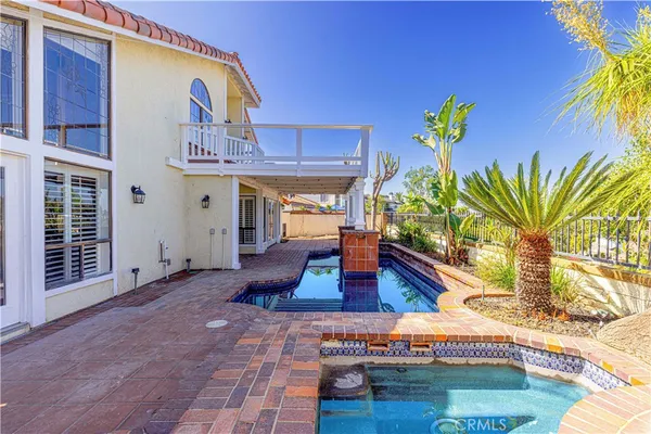 a front view of house with outdoor space and sitting area
