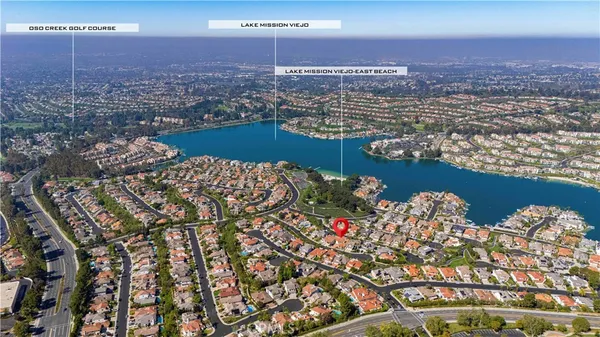 an aerial view of residential building and lake