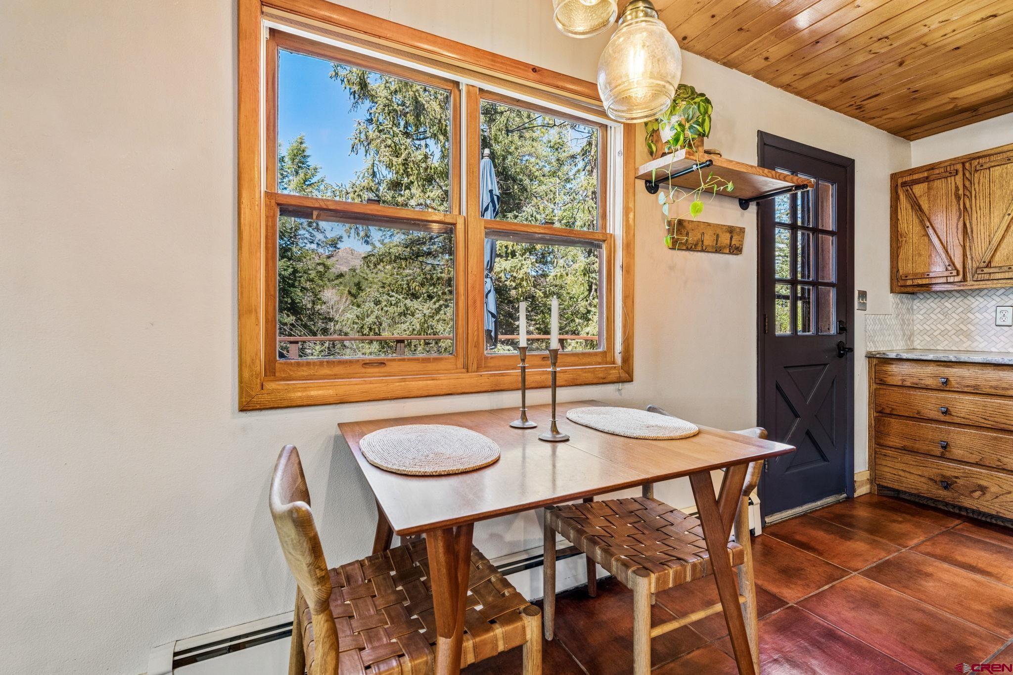 511 High Trails Drive Durango, CO 81301 - Photo 12 of 45 a view of a dining room with furniture and window