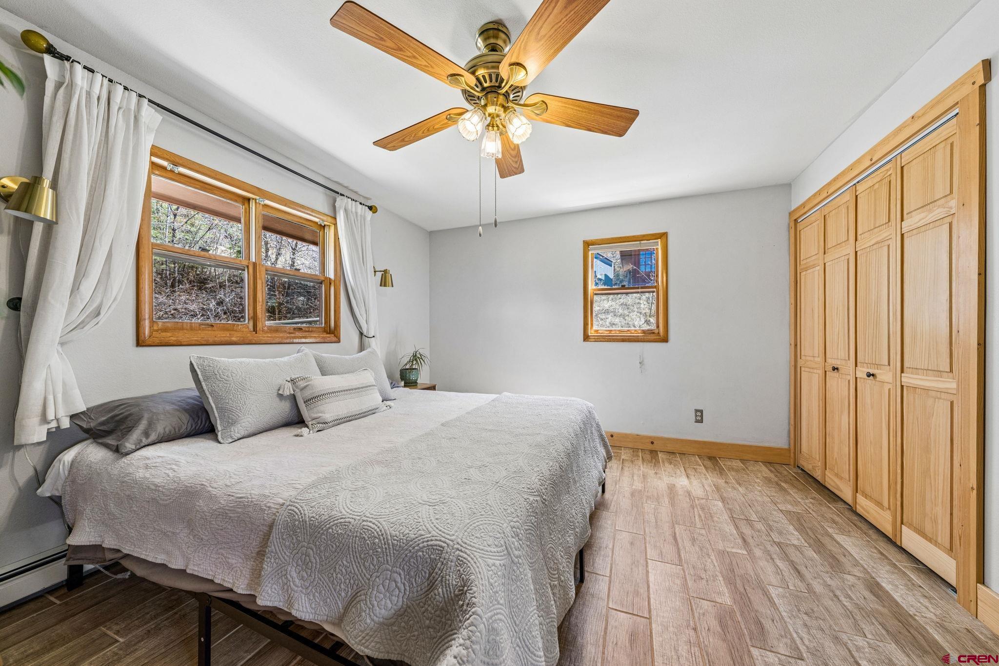 511 High Trails Drive Durango, CO 81301 - Photo 19 of 45 a bedroom with a large bed and a window