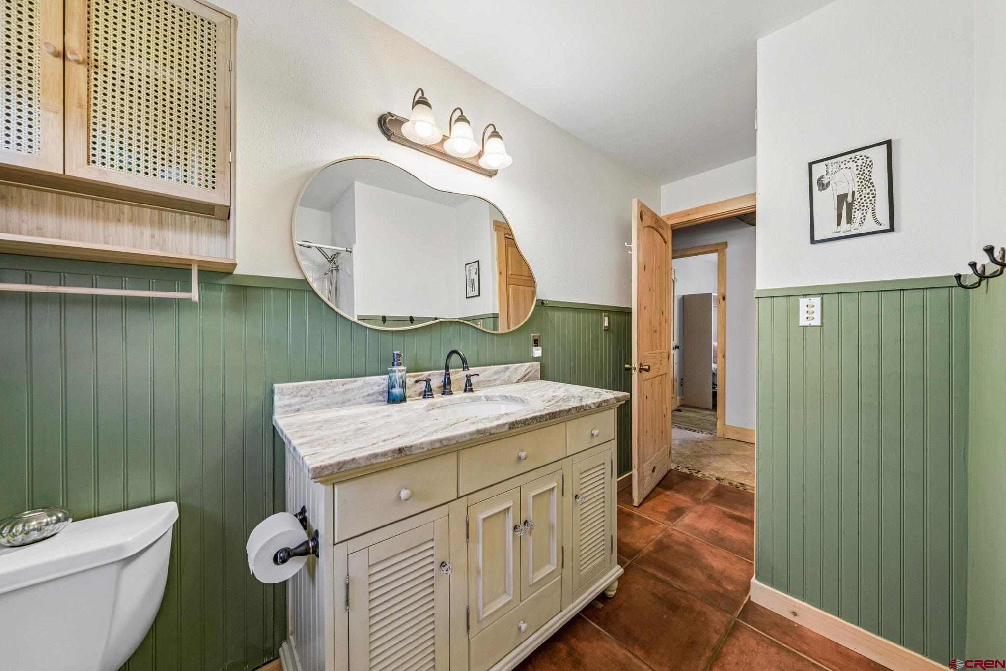 511 High Trails Drive Durango, CO 81301 - Photo 21 of 45 a bathroom with a toilet sink and mirror