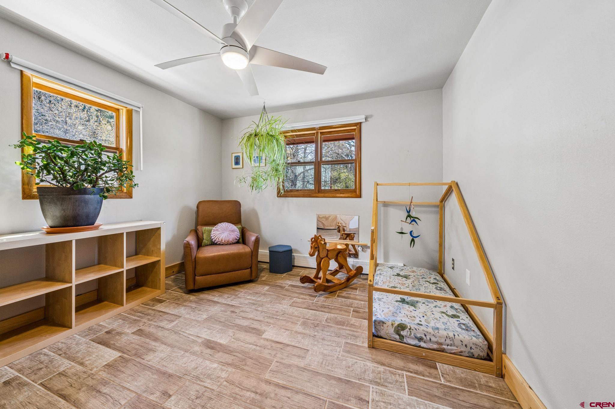511 High Trails Drive Durango, CO 81301 - Photo 23 of 45 a bedroom with furniture and a window