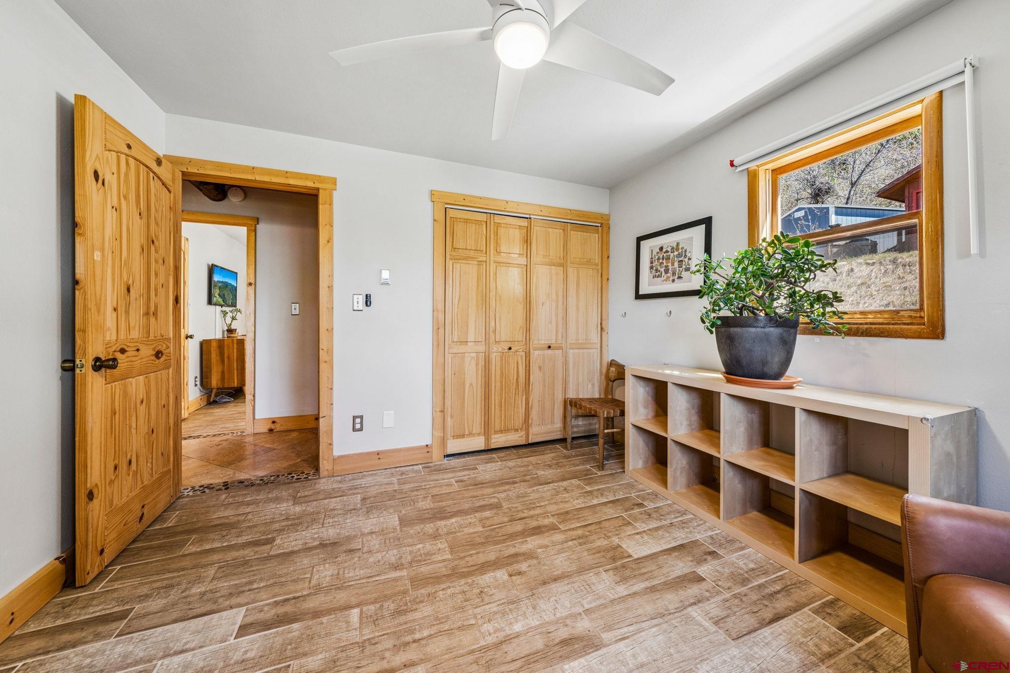 511 High Trails Drive Durango, CO 81301 - Photo 24 of 45 a view of a room with wooden floor and cabinet