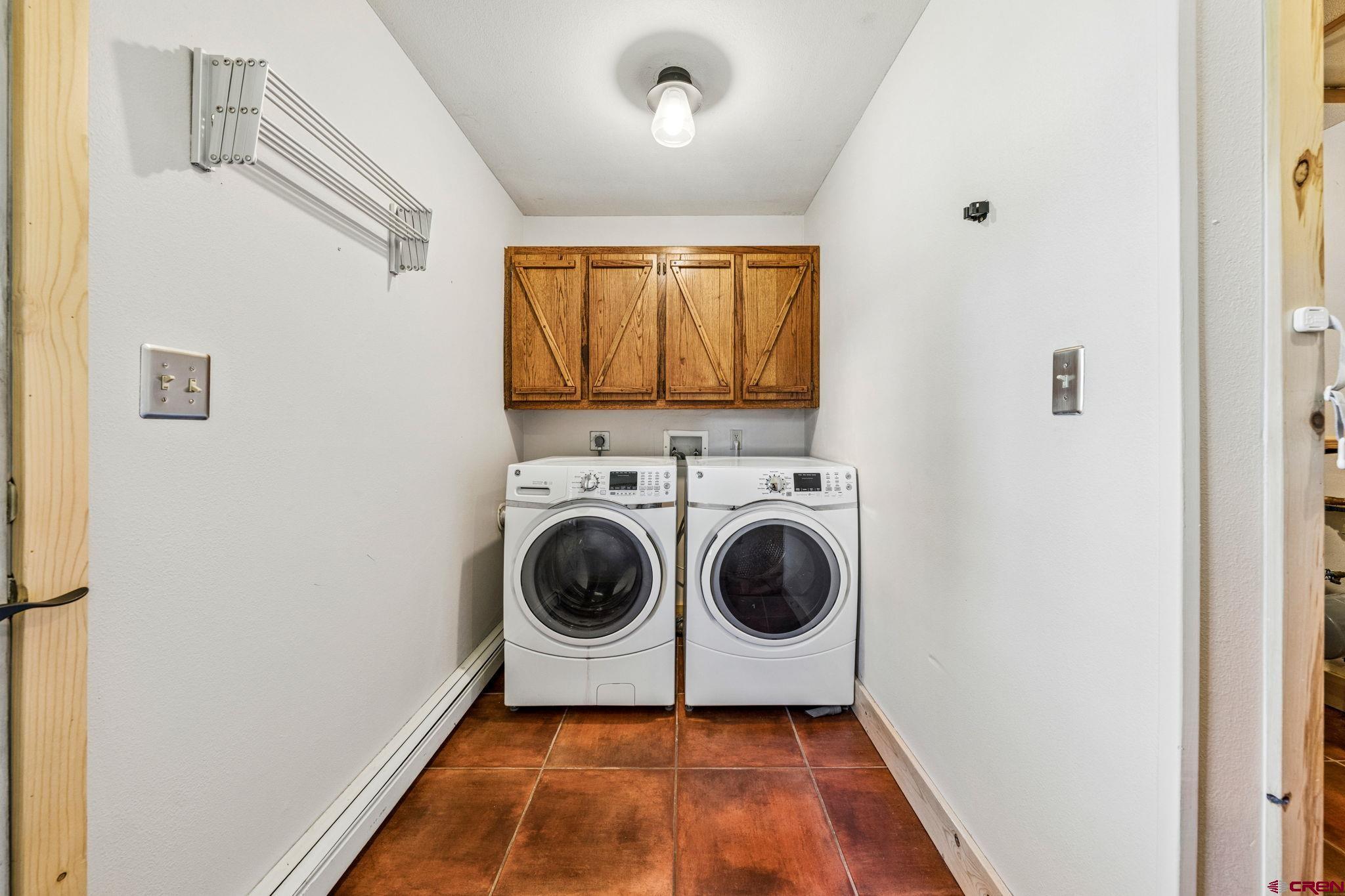 511 High Trails Drive Durango, CO 81301 - Photo 28 of 45 a utility room with dryer and washer
