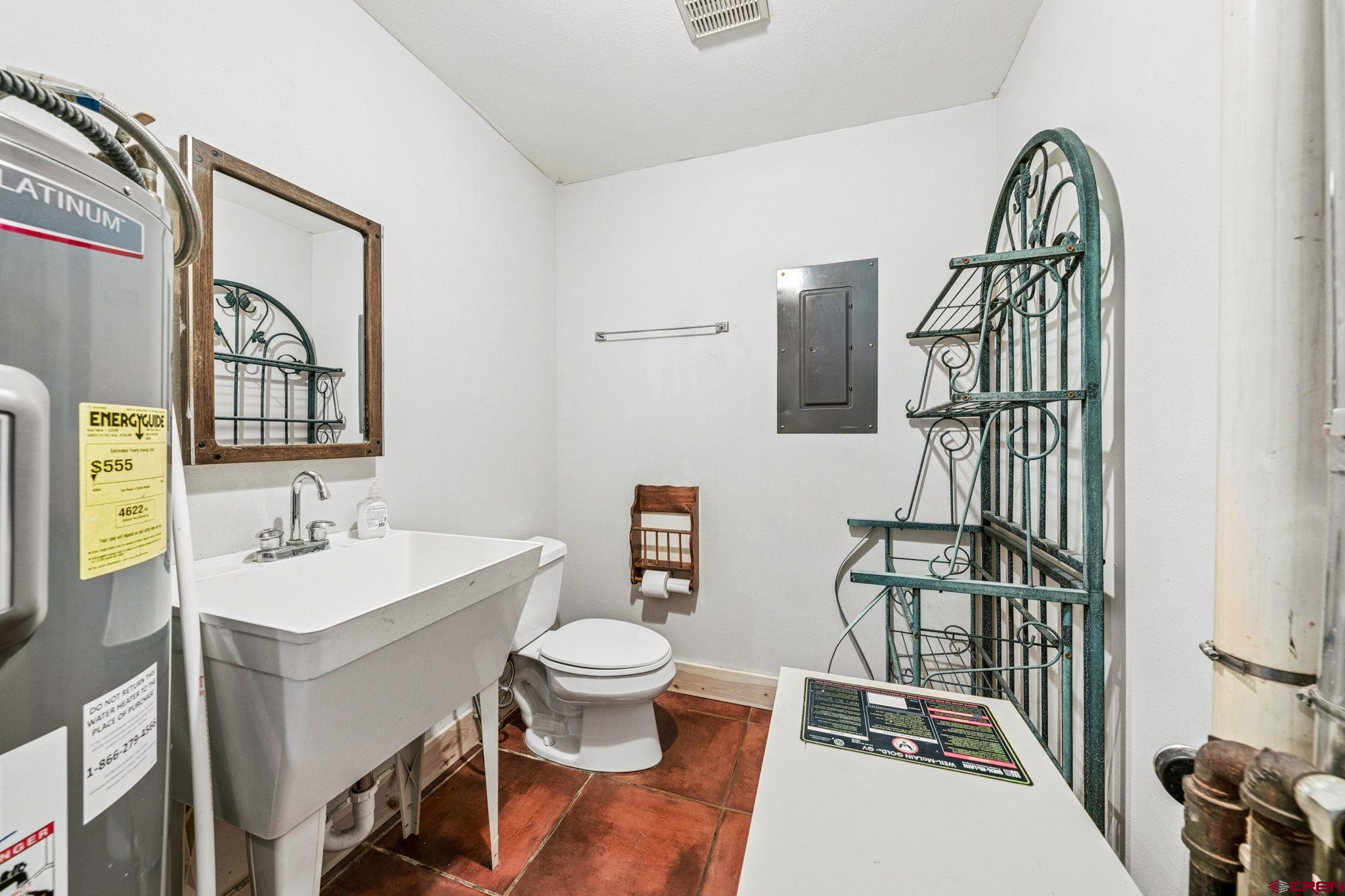 511 High Trails Drive Durango, CO 81301 - Photo 29 of 45 a bathroom with a sink toilet and mirror