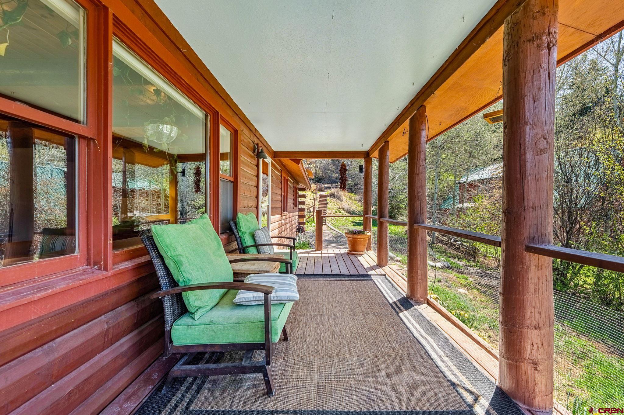 511 High Trails Drive Durango, CO 81301 - Photo 33 of 45 a view of two chairs in the balcony next to a yard