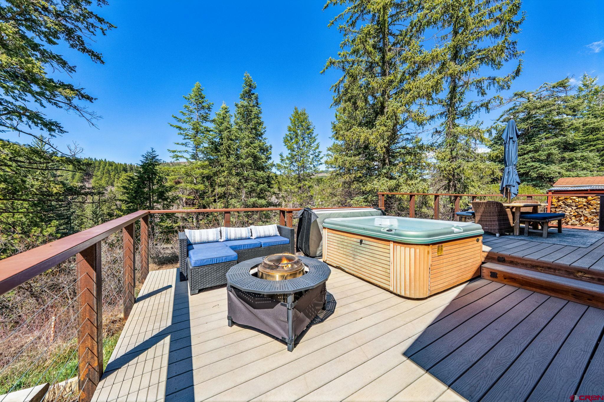 511 High Trails Drive Durango, CO 81301 - Photo 34 of 45 a view of a balcony with chairs and wooden floor