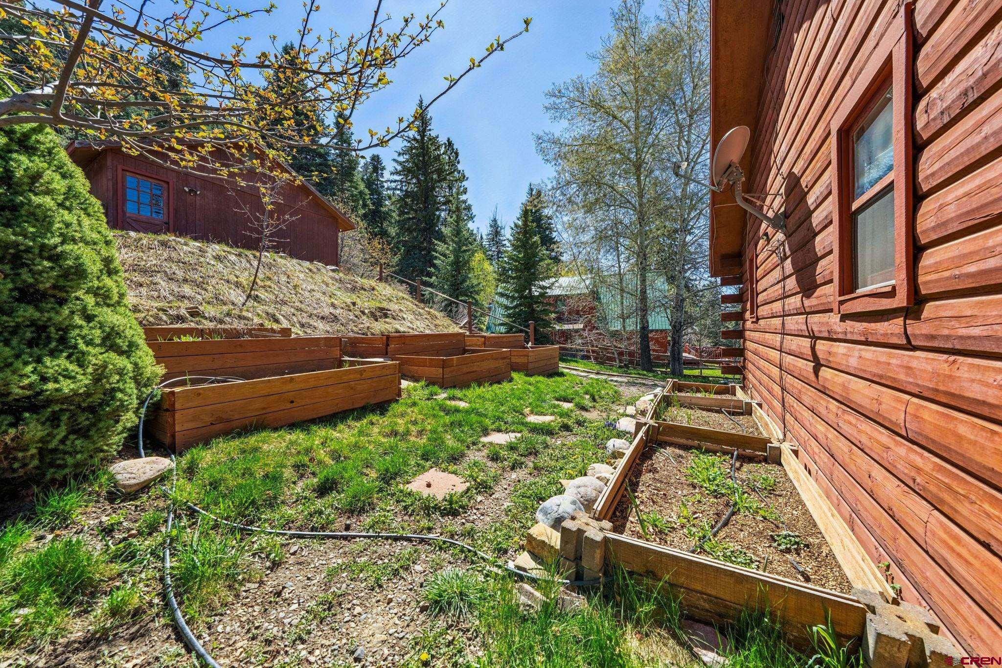 511 High Trails Drive Durango, CO 81301 - Photo 38 of 45 a view of a backyard with garden