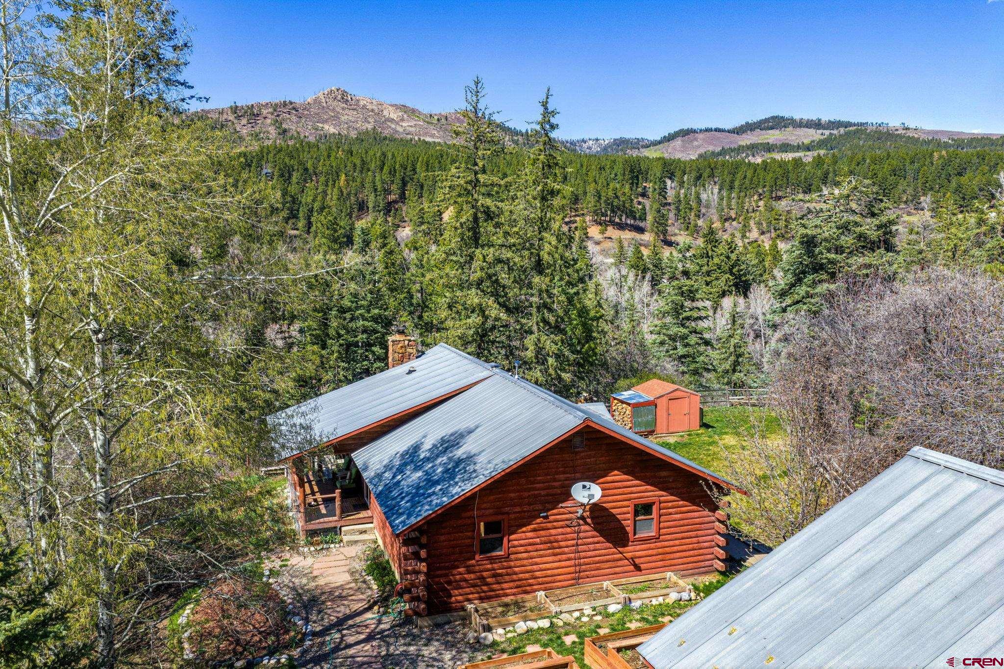 511 High Trails Drive Durango, CO 81301 - Photo 4 of 45 a view of a house with a yard