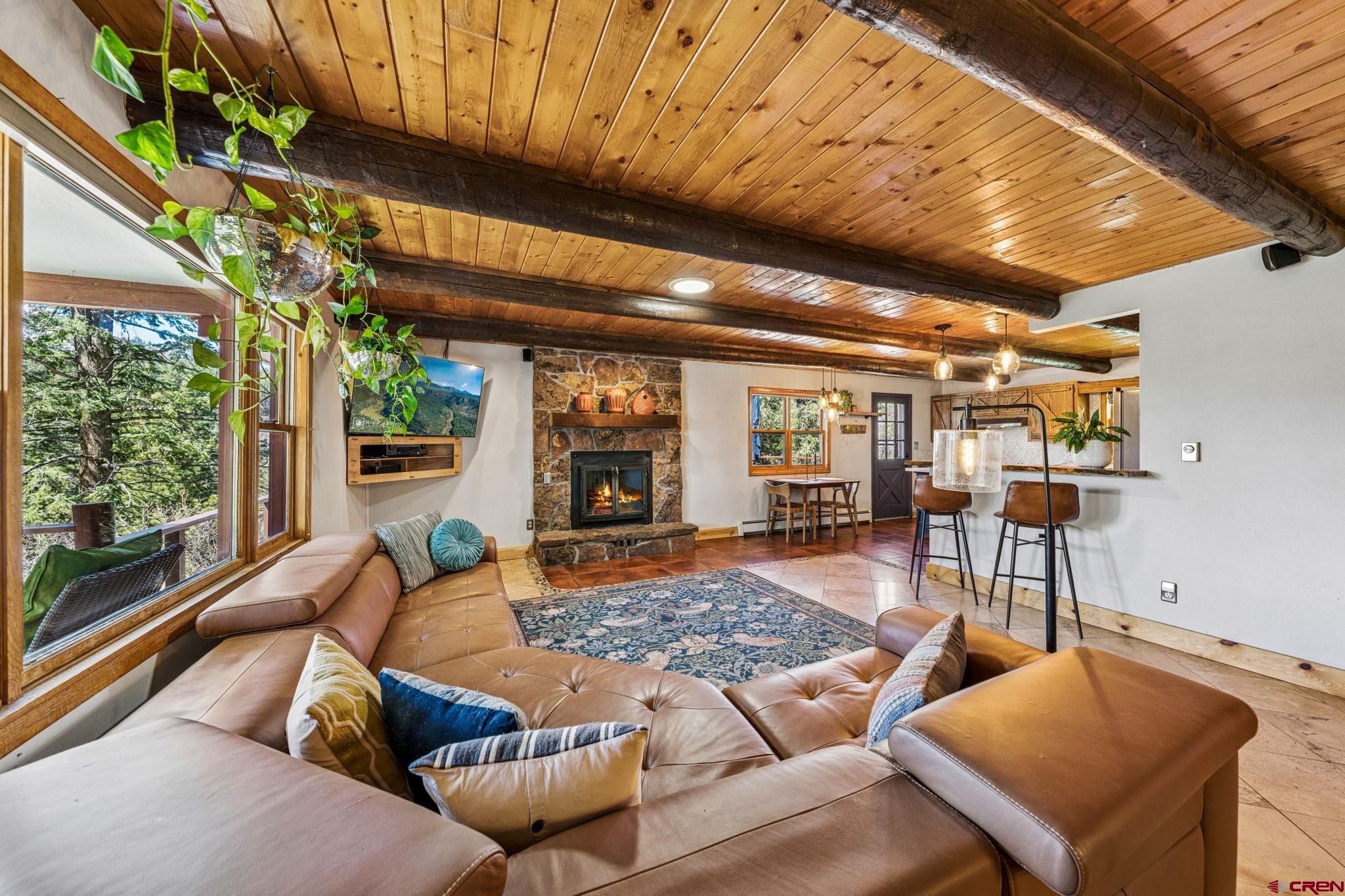 511 High Trails Drive Durango, CO 81301 - Photo 6 of 45 a living room with furniture a rug and a large window