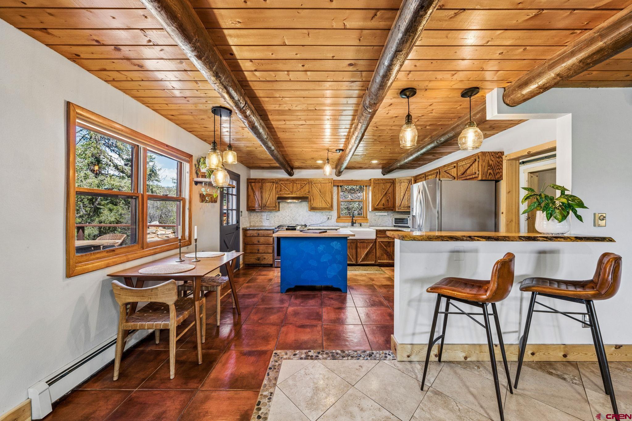 511 High Trails Drive Durango, CO 81301 - Photo 9 of 45 a view of a dining room with furniture window and wooden floor