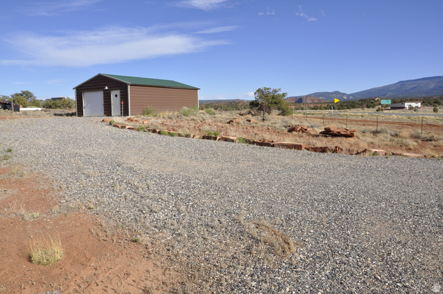 175 South S Highway East Torrey, UT 84775 - Photo 10 of 17 View of outbuilding with a rural view, a mountain view, and driveway
