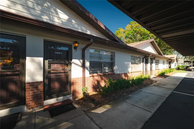 a patio with table and chairs