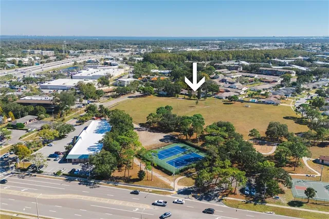 an aerial view of residential houses with outdoor space