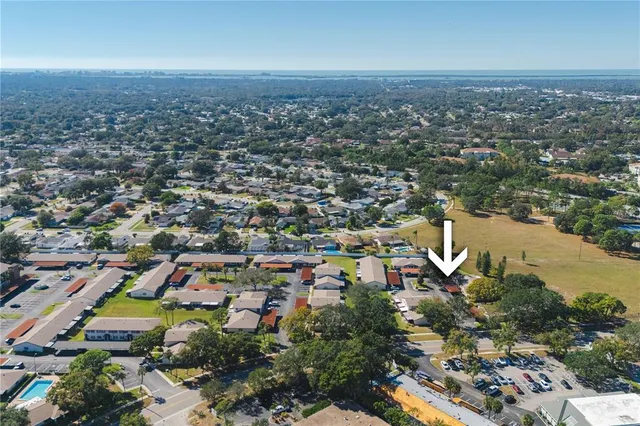 an aerial view of a house with swimming pool