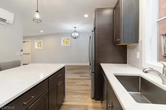 a kitchen that has a sink and a stove