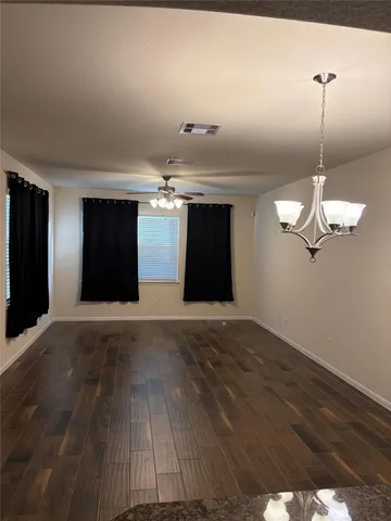a kitchen with granite countertop a sink and steel appliances