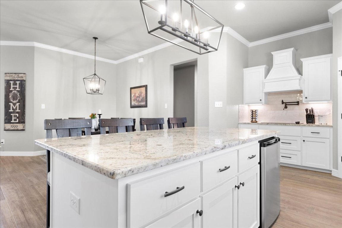 3810 Green Tree Loop Temple, TX 76502 - Photo 13 of 40 a bathroom with a granite countertop sink a large mirror and a wooden floor