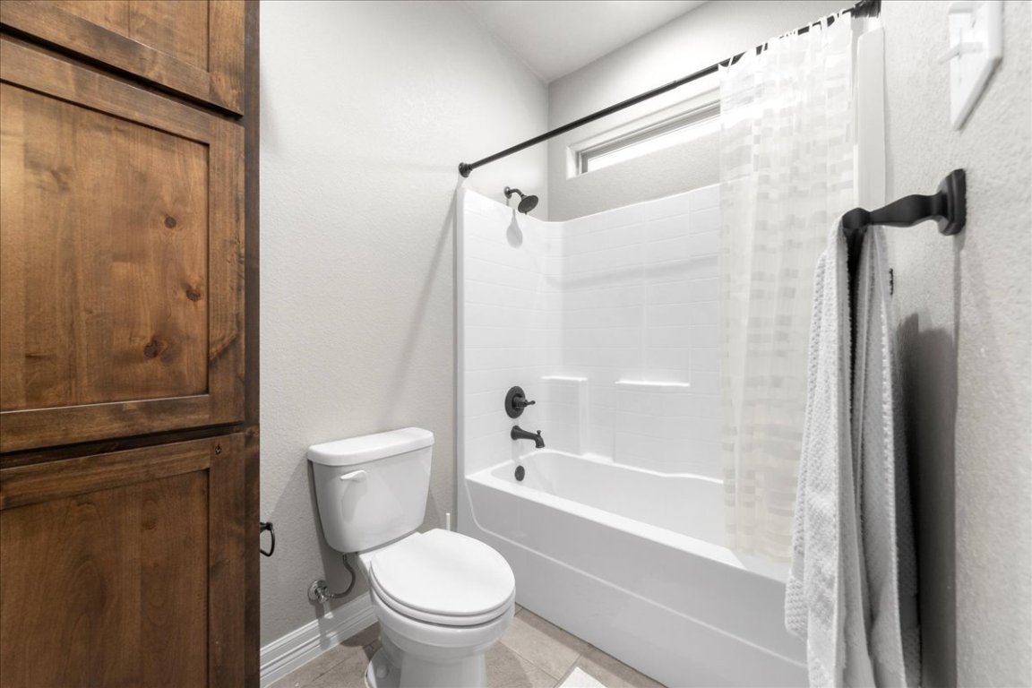 3810 Green Tree Loop Temple, TX 76502 - Photo 16 of 40 a bathroom with a toilet and a shower