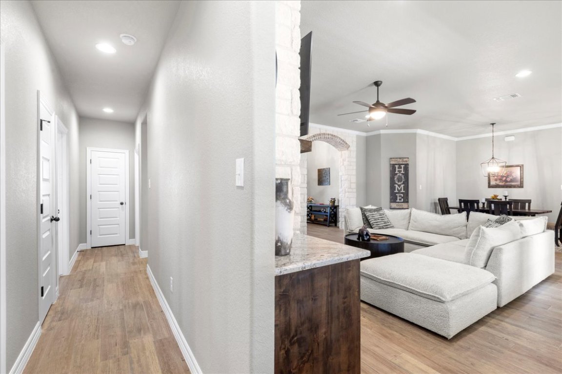 3810 Green Tree Loop Temple, TX 76502 - Photo 18 of 40 a living room with furniture and a chandelier