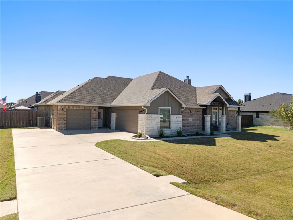 3810 Green Tree Loop Temple, TX 76502 - Photo 2 of 40 a front view of a house with a yard