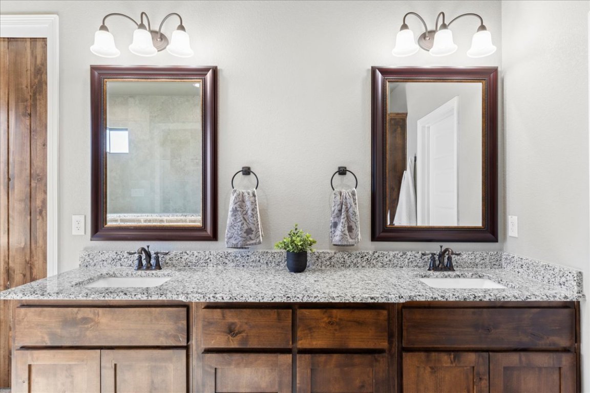 3810 Green Tree Loop Temple, TX 76502 - Photo 28 of 40 a bathroom with a granite countertop sink and a mirror