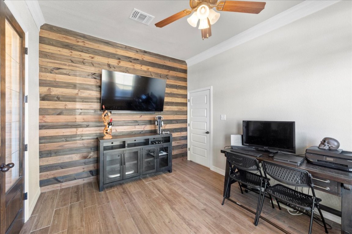 3810 Green Tree Loop Temple, TX 76502 - Photo 32 of 40 a room with furniture and flat screen tv
