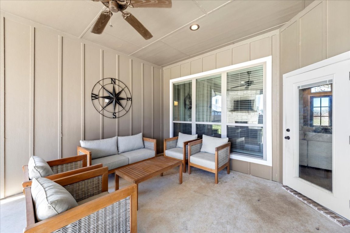 3810 Green Tree Loop Temple, TX 76502 - Photo 36 of 40 a living room with furniture and a floor to ceiling window