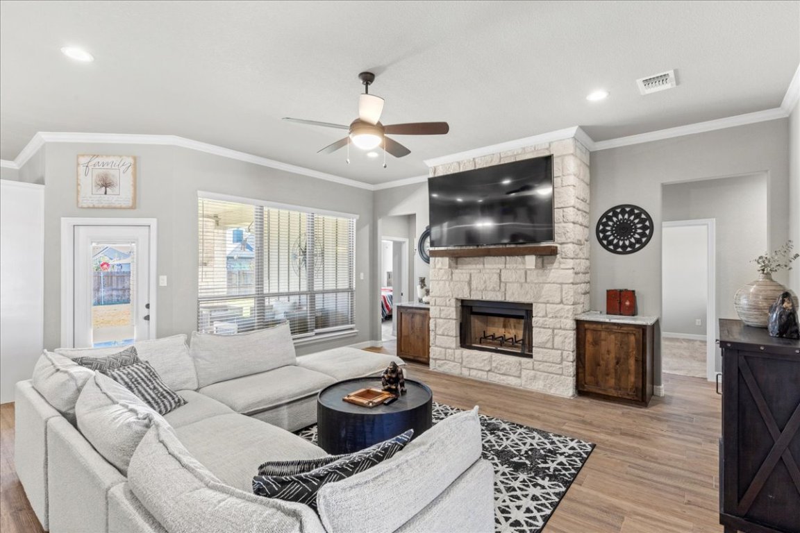 3810 Green Tree Loop Temple, TX 76502 - Photo 8 of 40 a living room with furniture a fireplace and a flat screen tv
