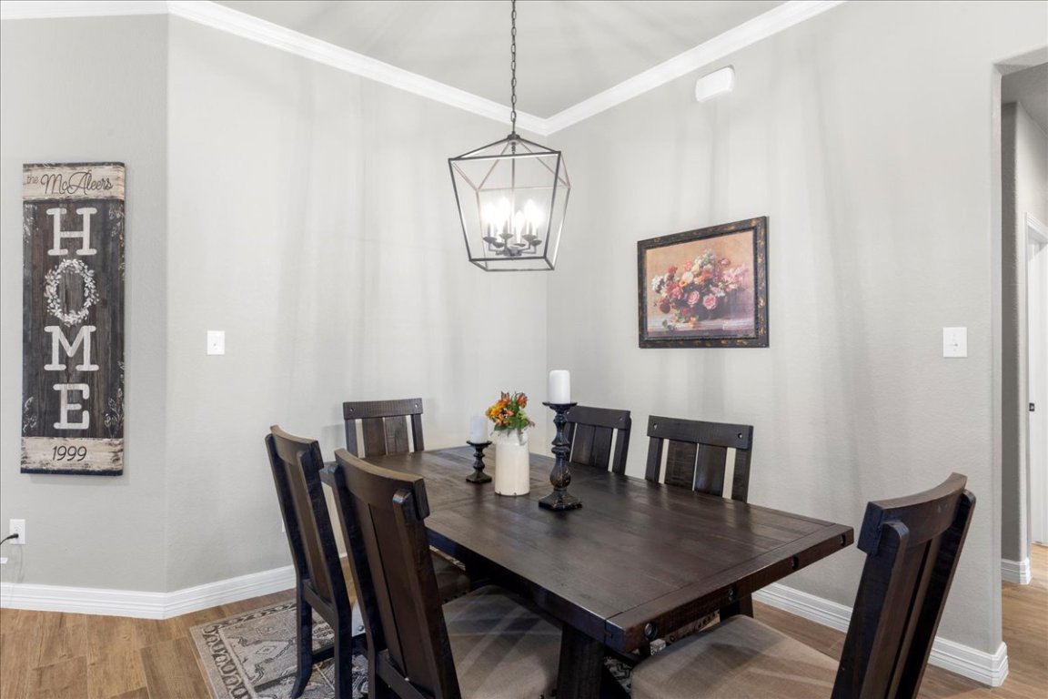 3810 Green Tree Loop Temple, TX 76502 - Photo 9 of 40 a view of a dining room with furniture and chandelier