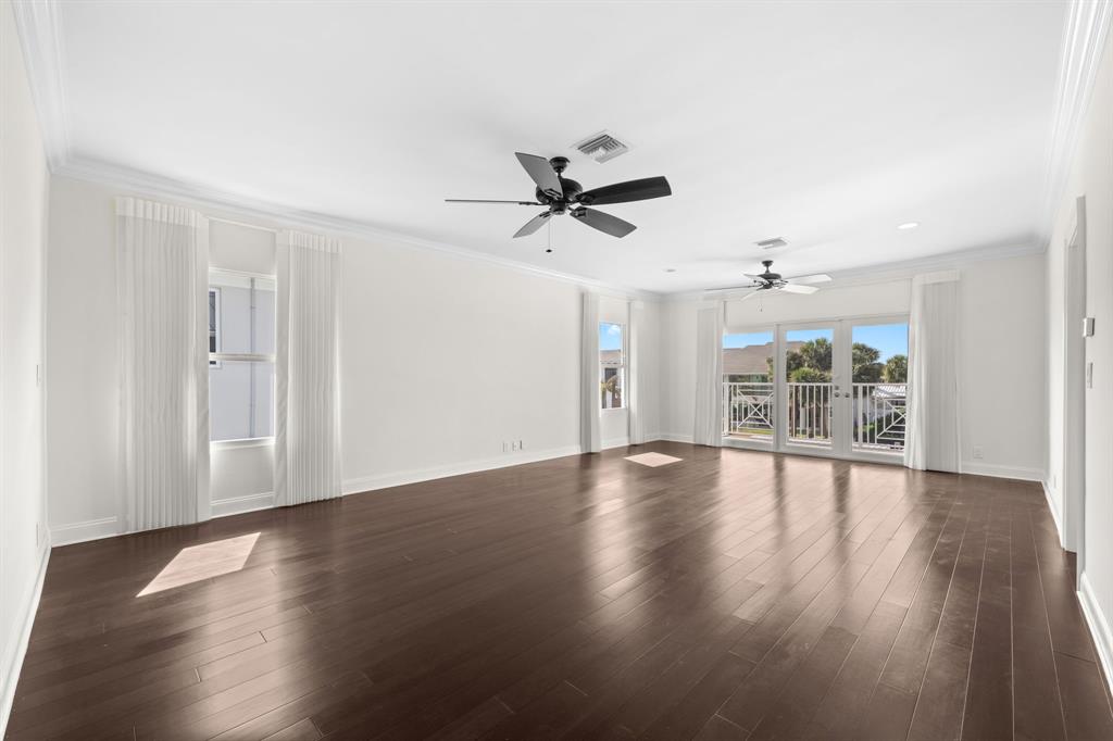 3741 Northeast 31st Avenue Lighthouse Point, FL 33064 - Photo 18 of 40 a view of an empty room with wooden floor and a window