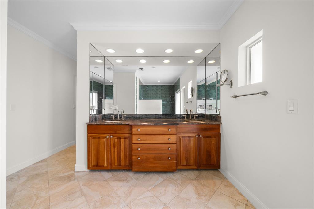 3741 Northeast 31st Avenue Lighthouse Point, FL 33064 - Photo 20 of 40 a bathroom with a granite countertop sink mirror and cabinets