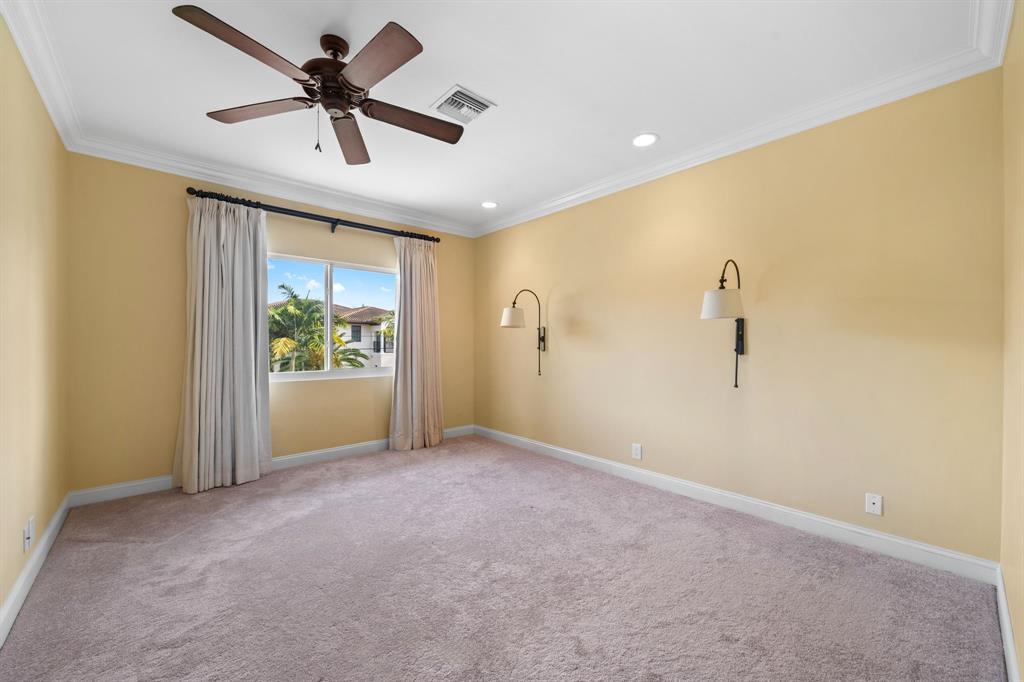 3741 Northeast 31st Avenue Lighthouse Point, FL 33064 - Photo 26 of 40 a view of a livingroom with a ceiling fan and window