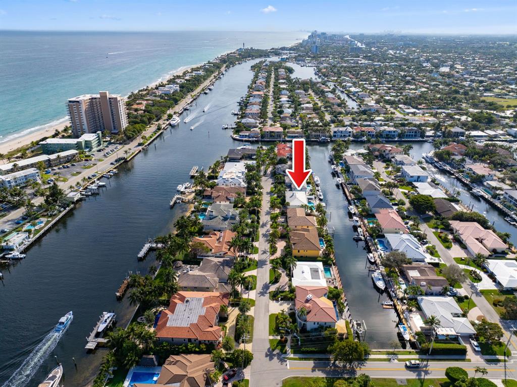 3741 Northeast 31st Avenue Lighthouse Point, FL 33064 - Photo 37 of 40 an aerial view of a city with lots of residential buildings ocean and mountain view in back