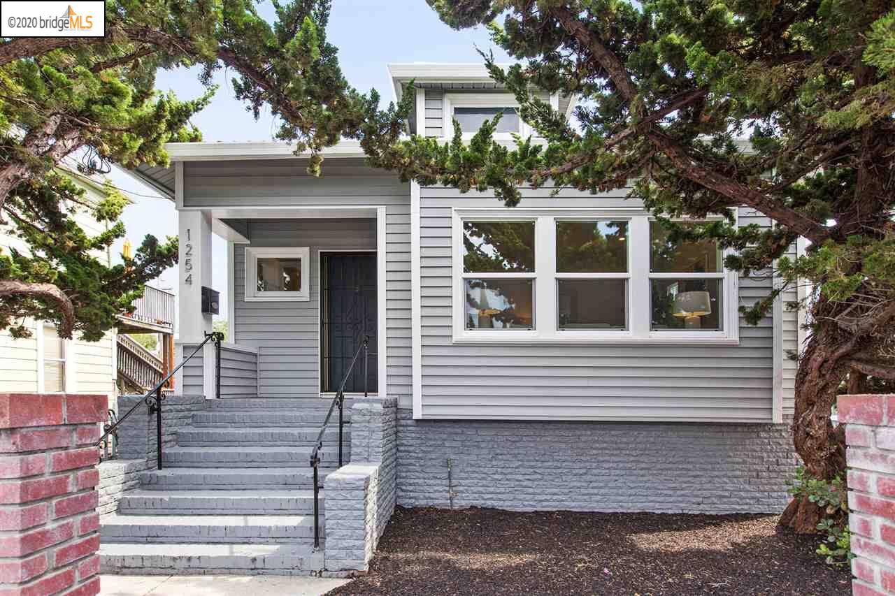 a view of house with outdoor space and trees