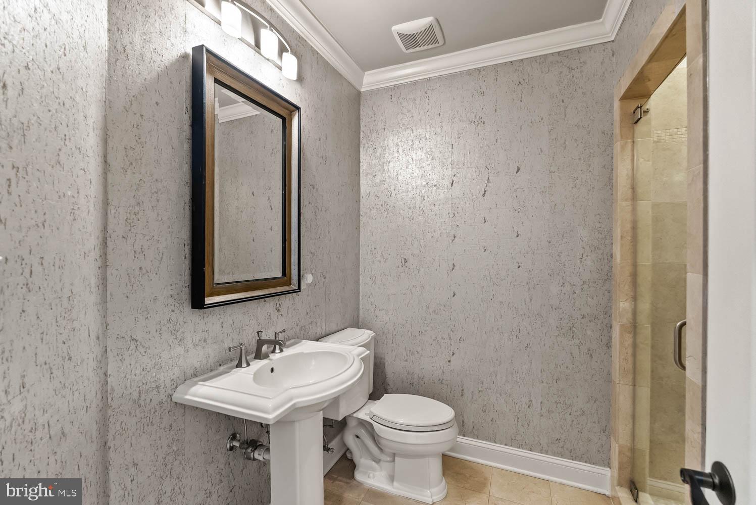 1224 R Street Northwest, Unit 2 Washington, DC 20009 - Photo 15 of 36 a bathroom with a toilet sink and mirror