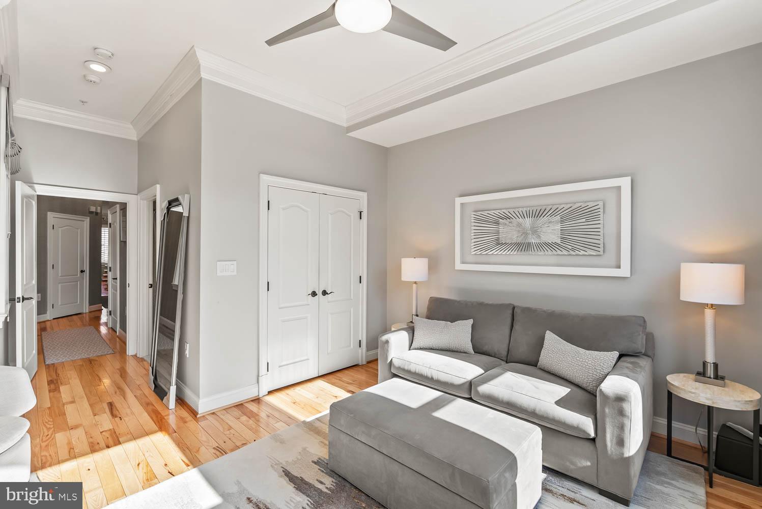 1224 R Street Northwest, Unit 2 Washington, DC 20009 - Photo 17 of 36 a living room with furniture and a walk in closet with wooden floor