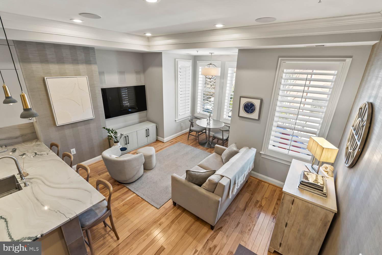 1224 R Street Northwest, Unit 2 Washington, DC 20009 - Photo 22 of 36 a living room with furniture a flat screen tv and a large window