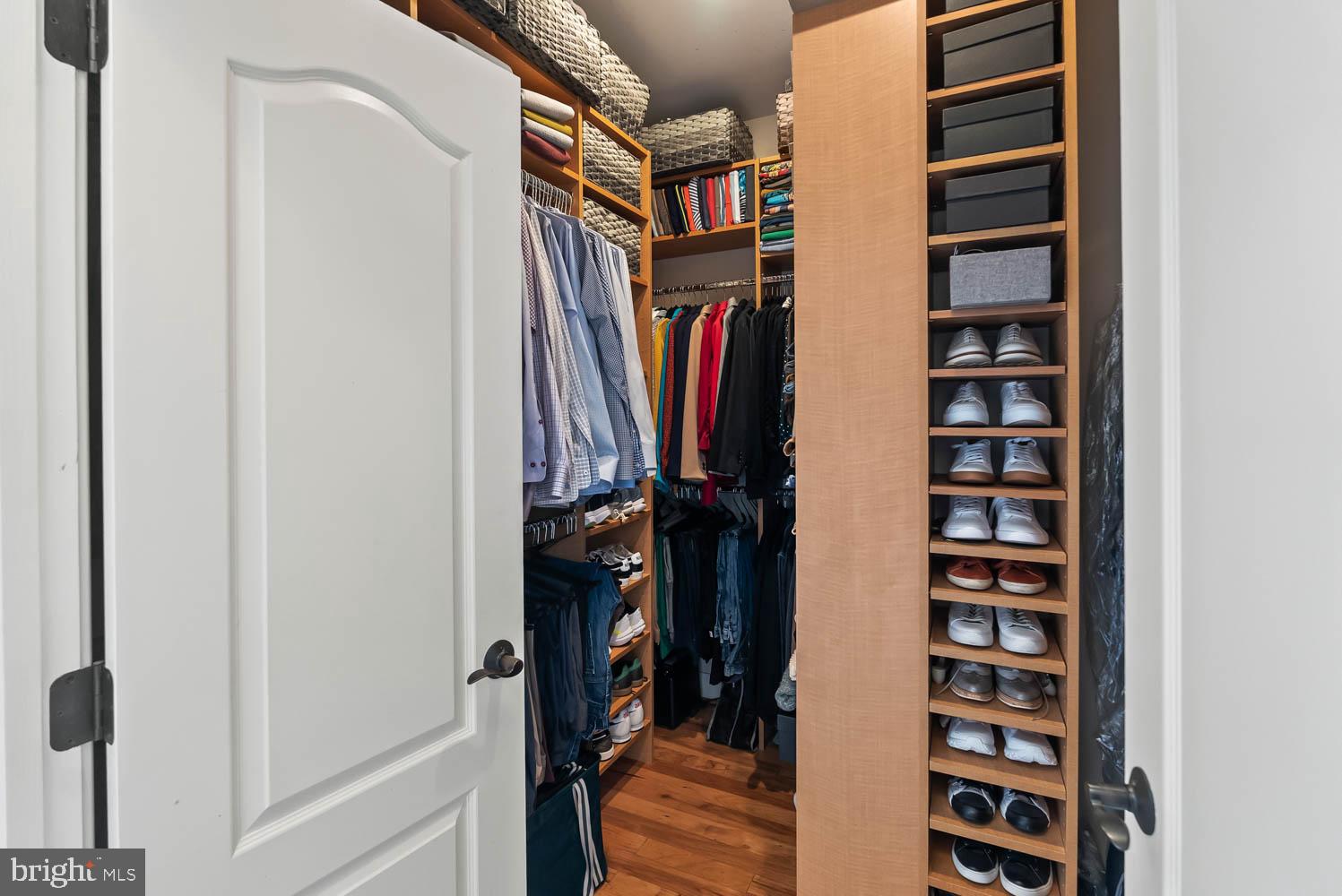1224 R Street Northwest, Unit 2 Washington, DC 20009 - Photo 29 of 36 a view of walk in closet with clothes and shoes