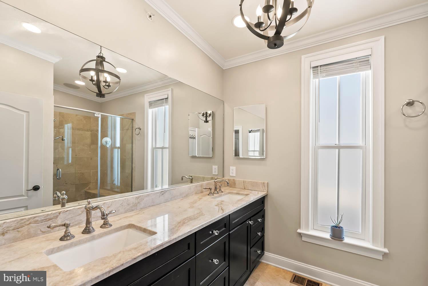 1224 R Street Northwest, Unit 2 Washington, DC 20009 - Photo 30 of 36 a bathroom with a granite countertop sink a large mirror and a window