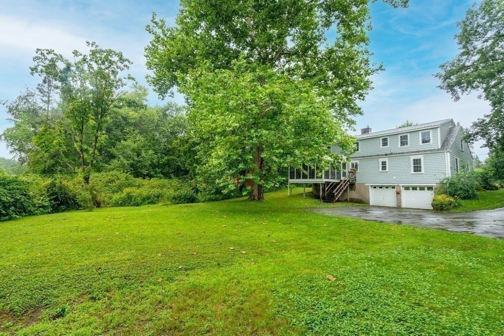 11 Wheelock Road Wayland, MA 01778 - Photo 22 of 24 a view of a house with a backyard