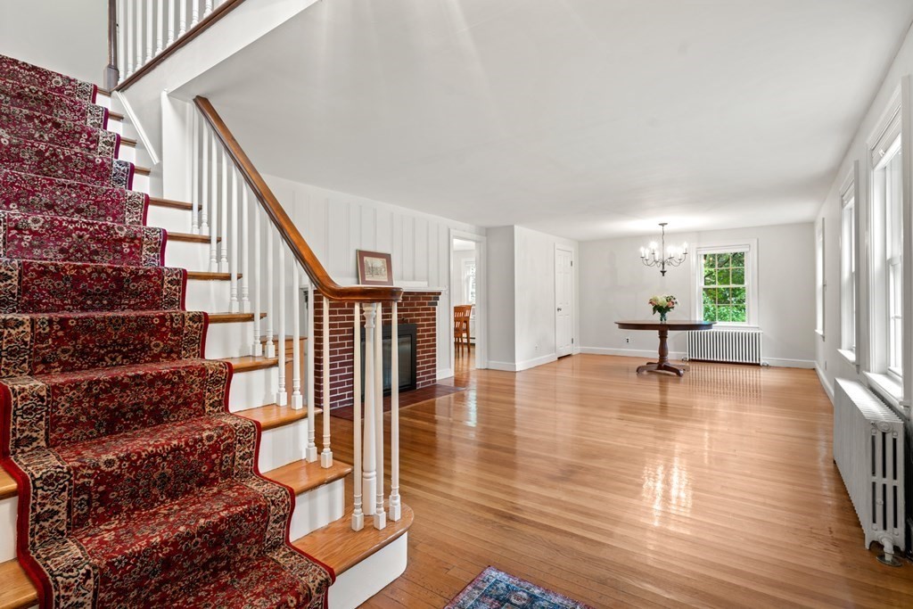 11 Wheelock Road Wayland, MA 01778 - Photo 3 of 24 a view of empty room with wooden floor and fan