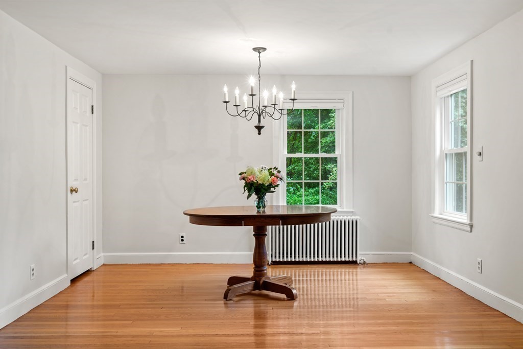 11 Wheelock Road Wayland, MA 01778 - Photo 5 of 24 a view of a livingroom with a window and wooden floor