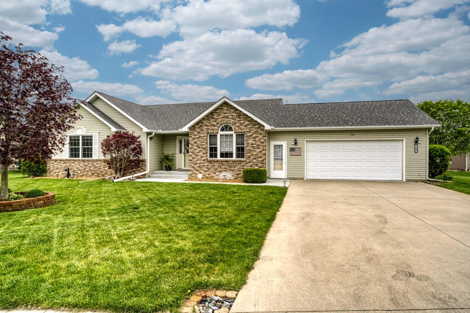 324 Forsythia Street Southeast De Motte, IN 46310 - Photo 1 of 1 a front view of a house with garden