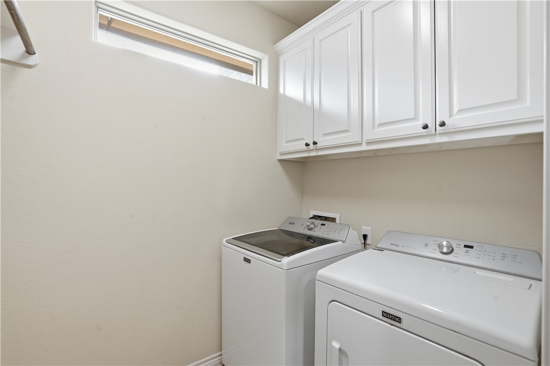 3516 Foxcroft Path Bryan, TX 77808 - Photo 25 of 38 a view of storage and utility room with washer and dryer