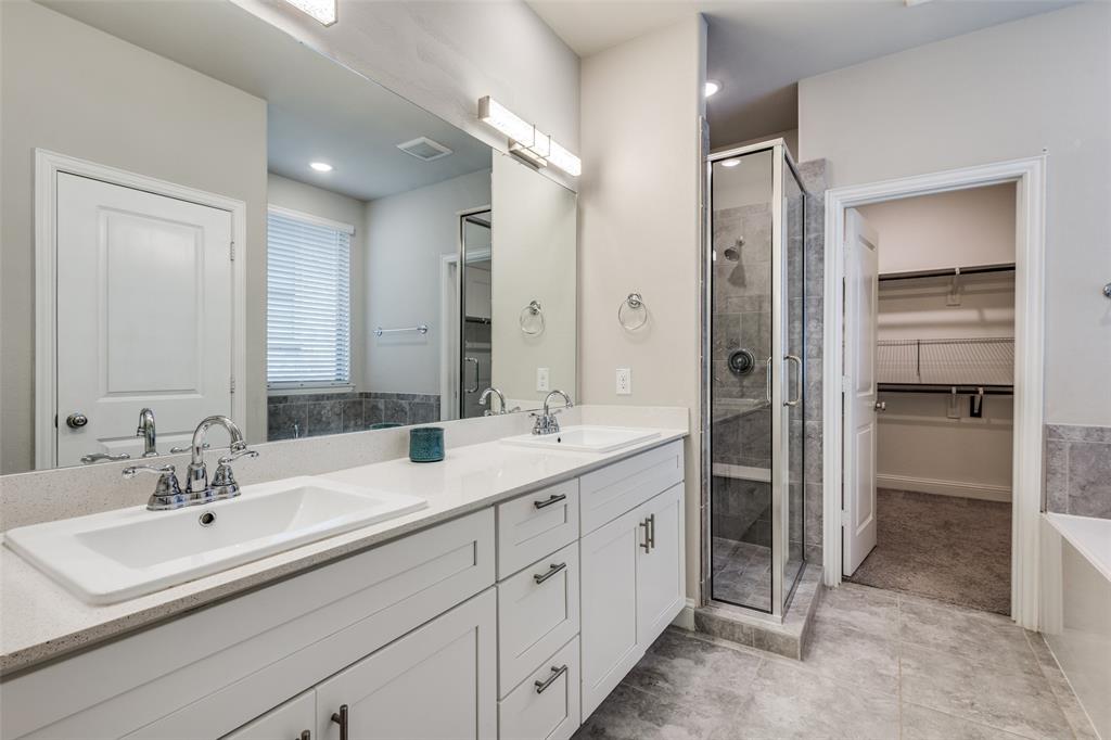 2912 Inn Kitchen Way McKinney, TX 75071 - Photo 18 of 29 a bathroom with a double vanity sink mirror and double