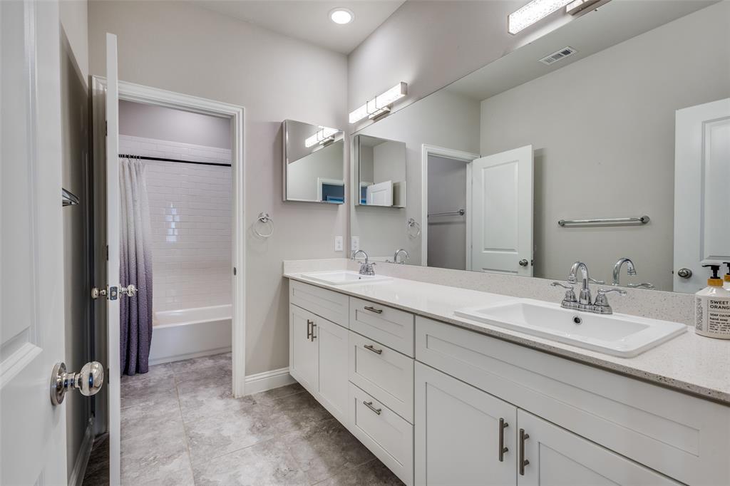2912 Inn Kitchen Way McKinney, TX 75071 - Photo 20 of 29 a spacious bathroom with a double vanity sink mirror and double