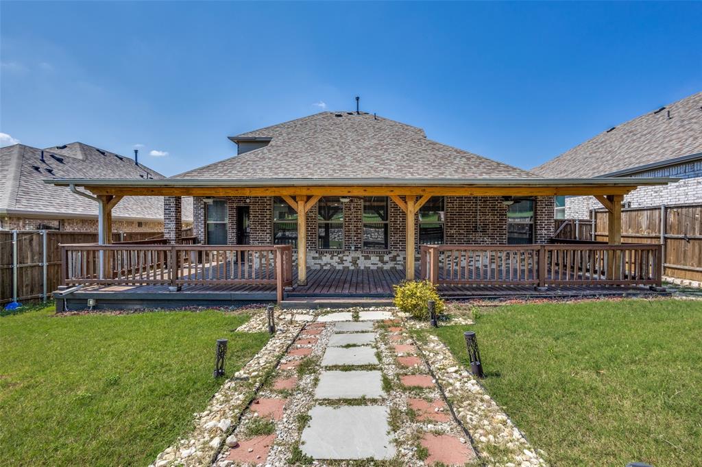 2912 Inn Kitchen Way McKinney, TX 75071 - Photo 24 of 29 a view of a house with a yard and a patio
