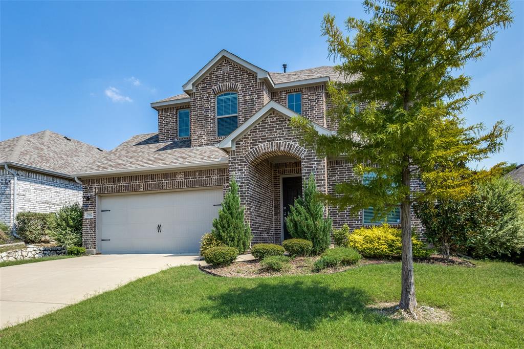 2912 Inn Kitchen Way McKinney, TX 75071 - Photo 29 of 29 a front view of a house with a yard and garage