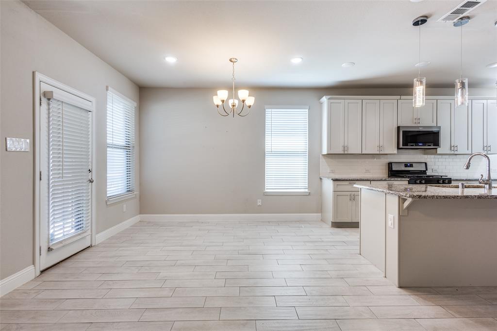2912 Inn Kitchen Way McKinney, TX 75071 - Photo 6 of 29 a view of kitchen with microwave and cabinets